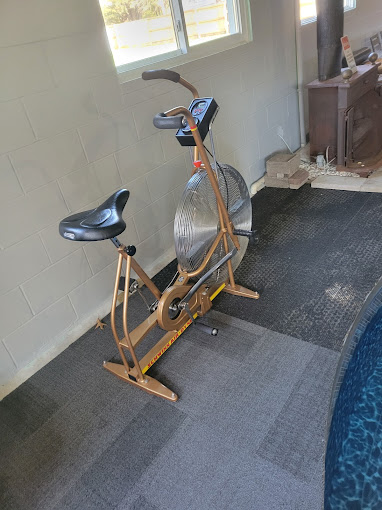 A stationary exercise bike in a home gym